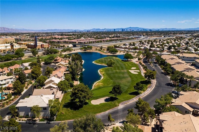 drone / aerial view featuring a residential view and a water and mountain view