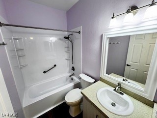 full bathroom with washtub / shower combination, vanity, and toilet