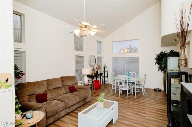 living room featuring high vaulted ceiling, hardwood / wood-style floors, and ceiling fan