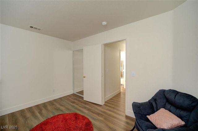 sitting room featuring hardwood / wood-style floors