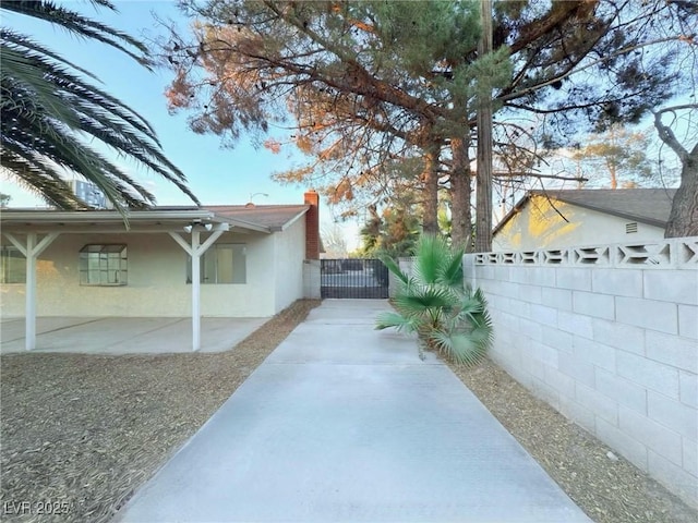 view of side of home featuring a patio area