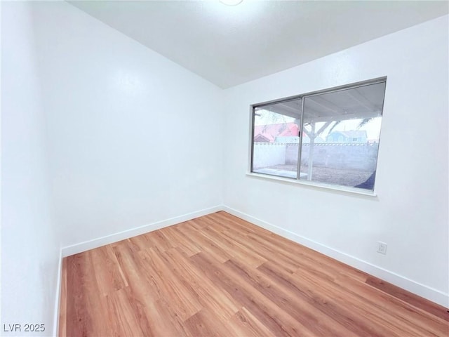 spare room featuring hardwood / wood-style flooring