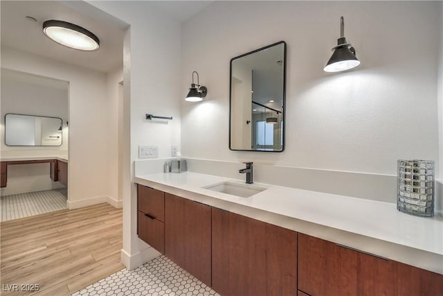 bathroom featuring vanity and hardwood / wood-style floors