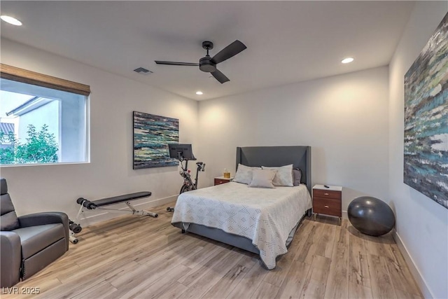 bedroom featuring light hardwood / wood-style flooring and ceiling fan