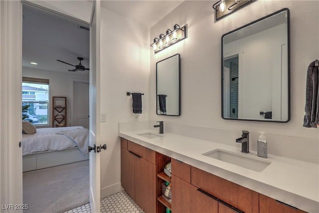 bathroom featuring ceiling fan, vanity, and tile patterned floors