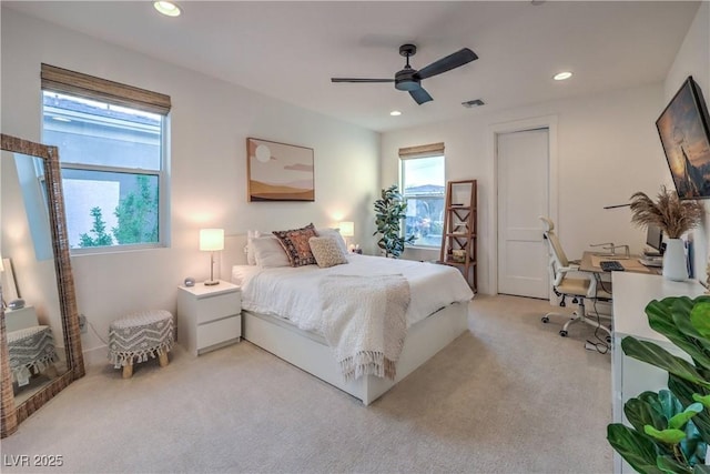 bedroom with light colored carpet and ceiling fan