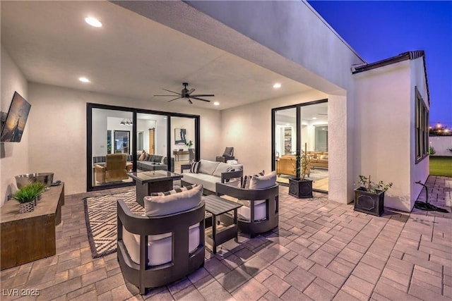 view of patio / terrace with an outdoor living space and ceiling fan