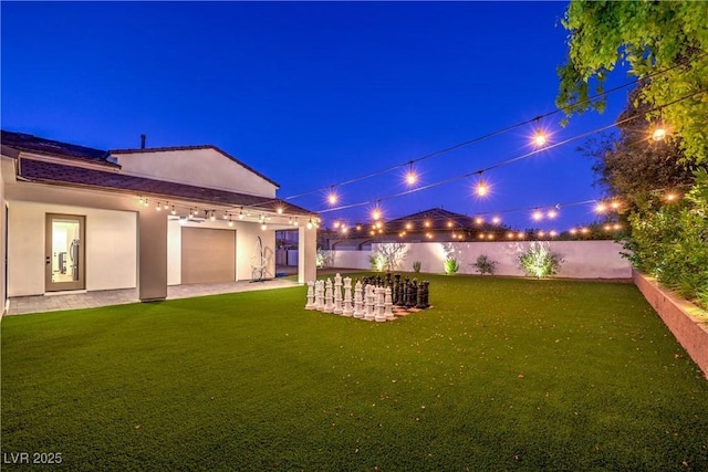 view of yard at night