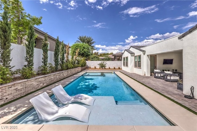 view of swimming pool with a patio area