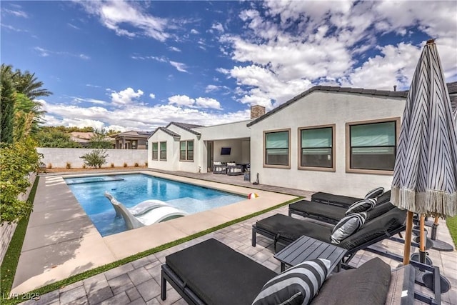 view of swimming pool featuring a patio