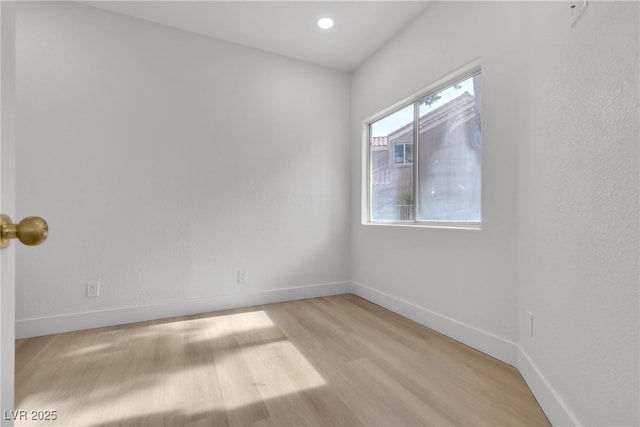 unfurnished room featuring light hardwood / wood-style floors