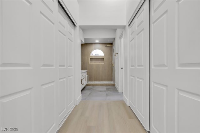 corridor featuring light hardwood / wood-style floors