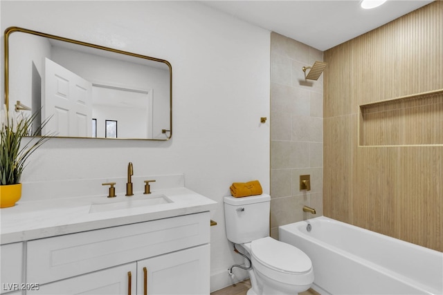 full bathroom featuring toilet, vanity, and tiled shower / bath