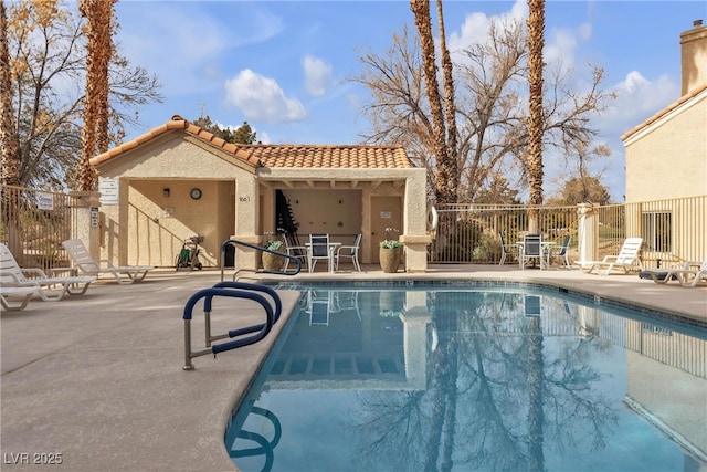 view of swimming pool featuring a patio area