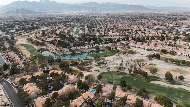 birds eye view of property with a water and mountain view