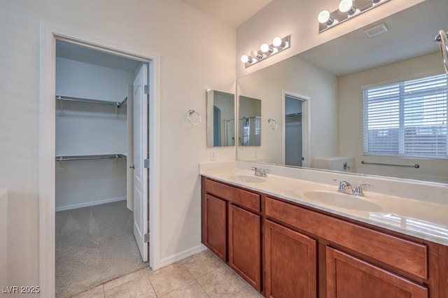 bathroom featuring tile patterned flooring, vanity, and separate shower and tub