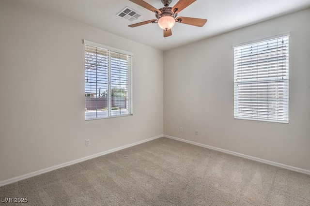 spare room featuring carpet floors and ceiling fan