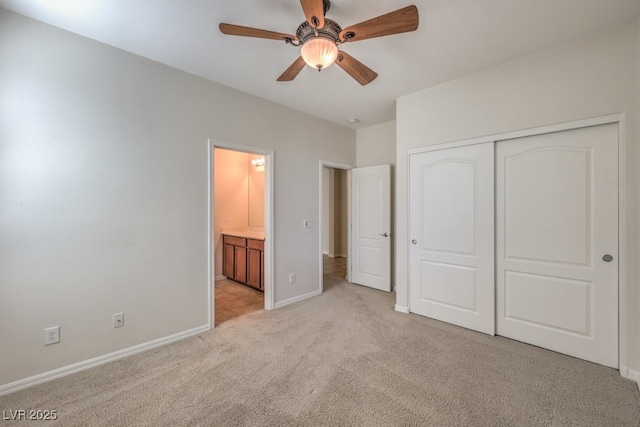 unfurnished bedroom featuring light colored carpet, a closet, and ceiling fan