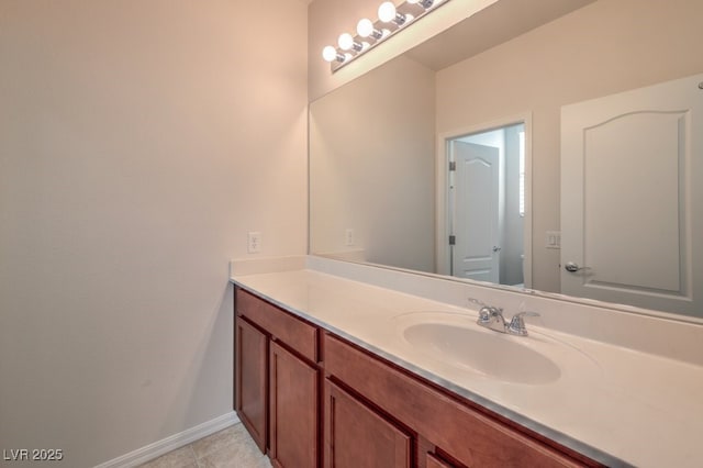 bathroom with tile patterned floors and vanity