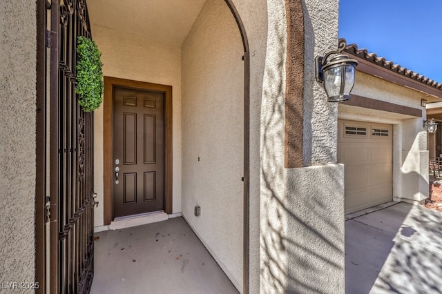 property entrance featuring a garage