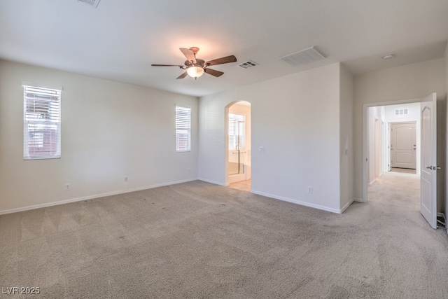 unfurnished room featuring light colored carpet and ceiling fan