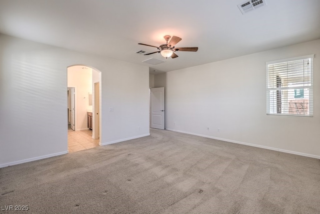 unfurnished room featuring light colored carpet and ceiling fan