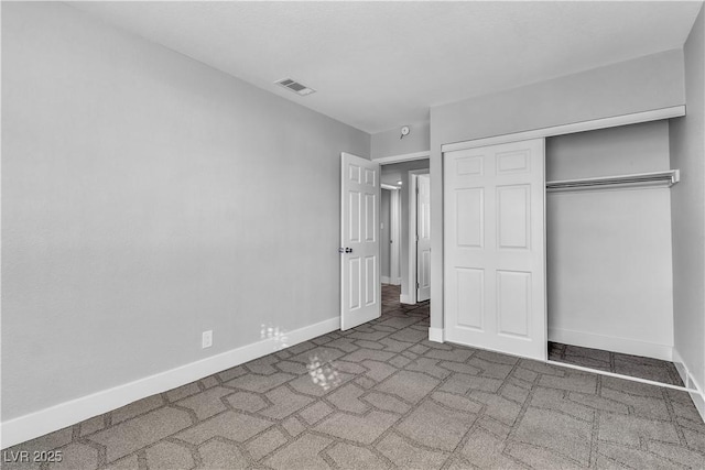 unfurnished bedroom with a closet