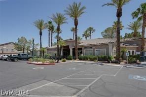 view of property featuring uncovered parking