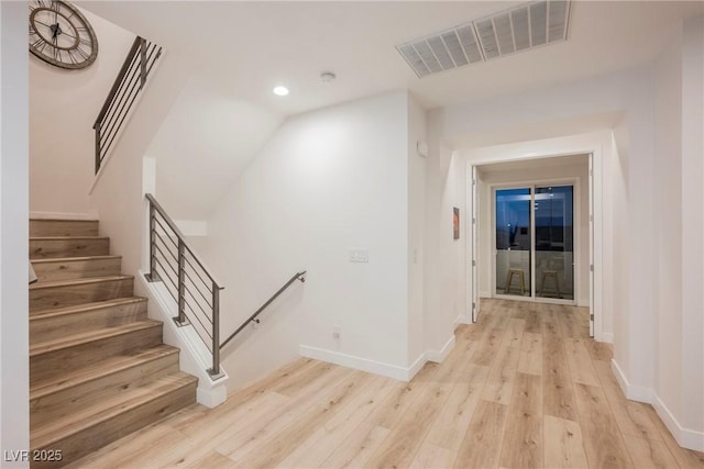 hall with light wood-type flooring