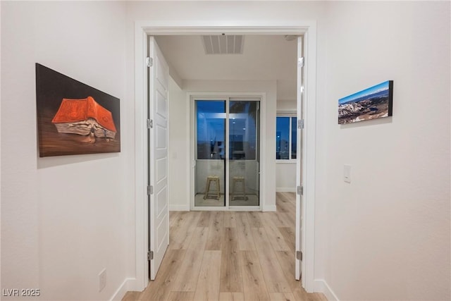 hallway featuring light hardwood / wood-style flooring