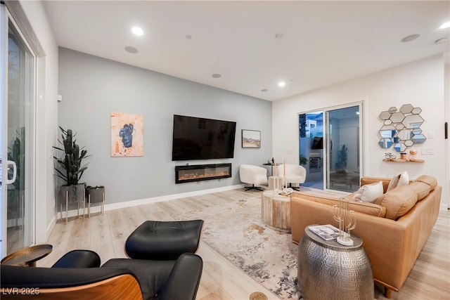 living room with light hardwood / wood-style flooring