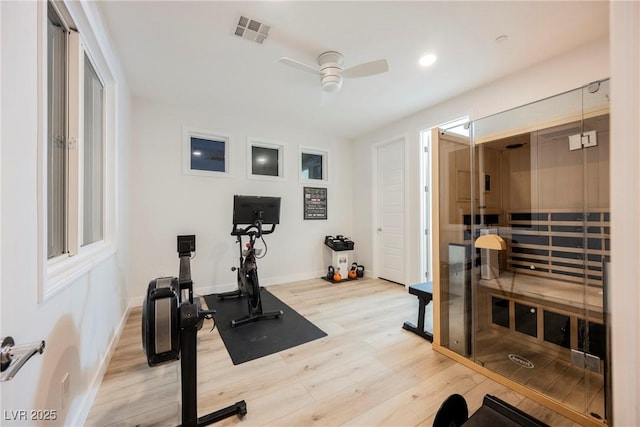 exercise room featuring hardwood / wood-style floors and ceiling fan