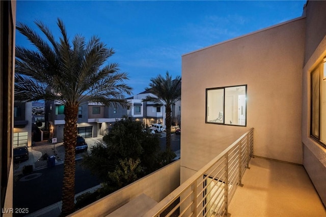 view of balcony at dusk