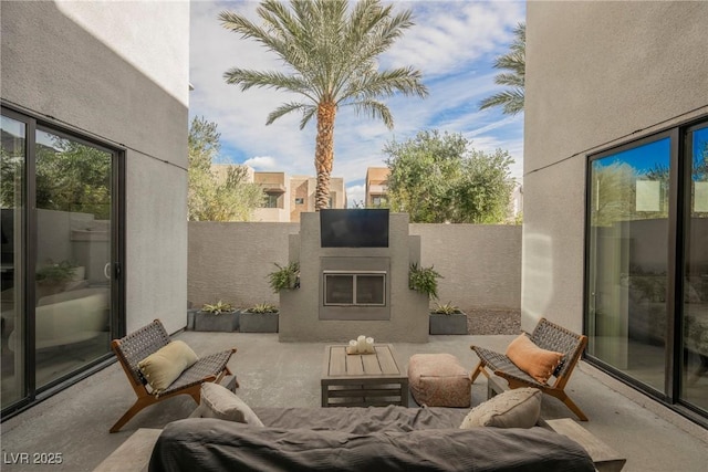 view of patio / terrace featuring a fireplace