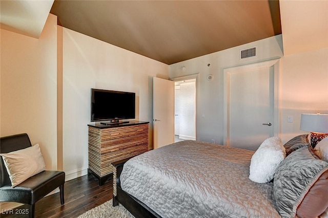 bedroom featuring dark hardwood / wood-style flooring