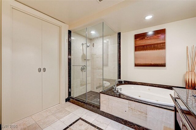 bathroom featuring plus walk in shower and vanity