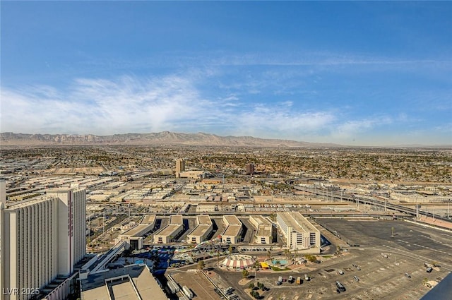 birds eye view of property with a mountain view