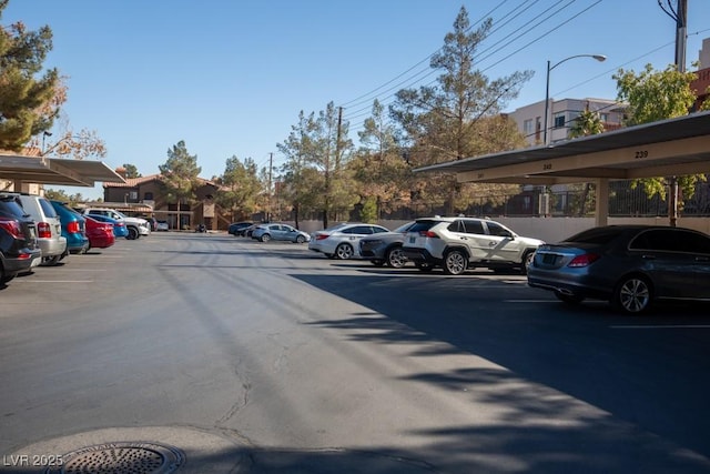 view of parking / parking lot with a carport