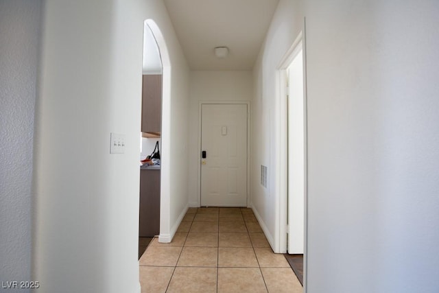 hallway featuring light tile patterned floors