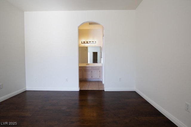 unfurnished room featuring dark wood-type flooring