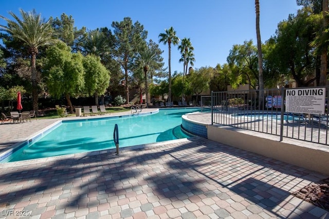 view of pool featuring a patio