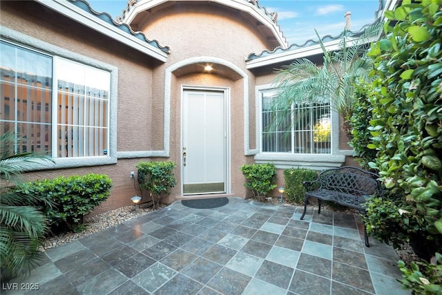 property entrance with a patio