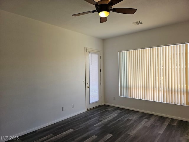 unfurnished room with ceiling fan and dark hardwood / wood-style flooring