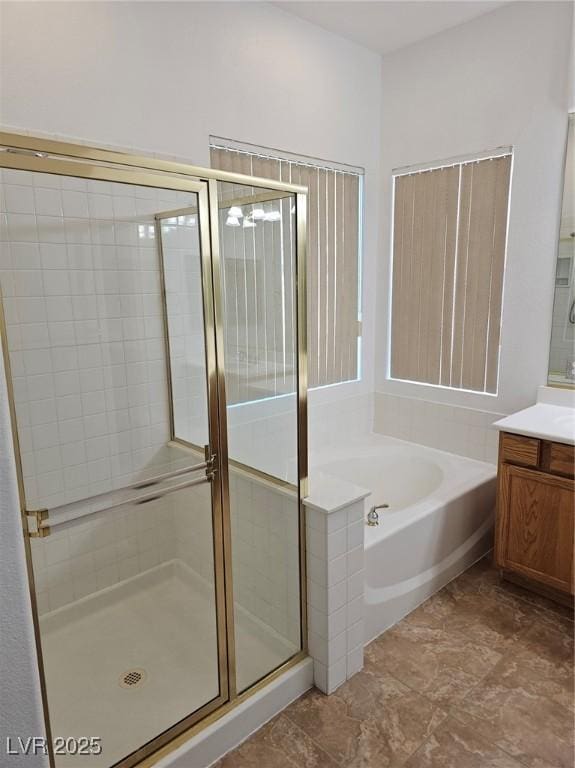 bathroom with plus walk in shower and vanity