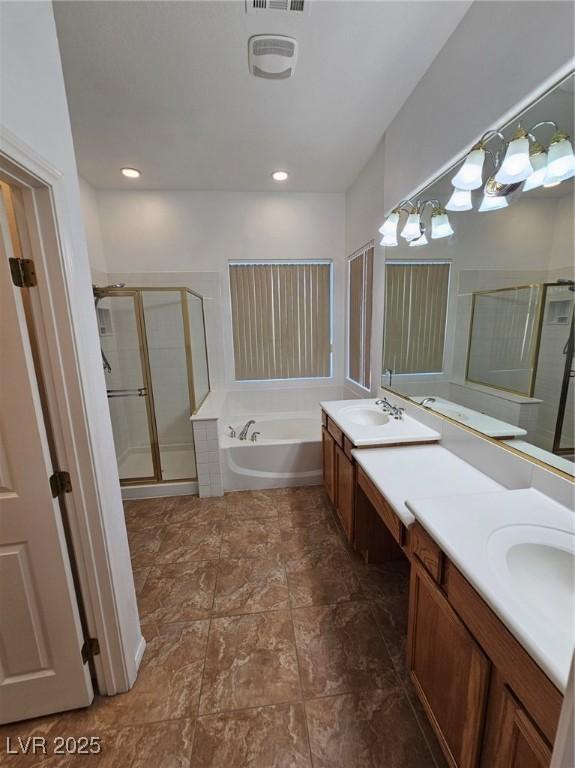 bathroom featuring vanity and plus walk in shower