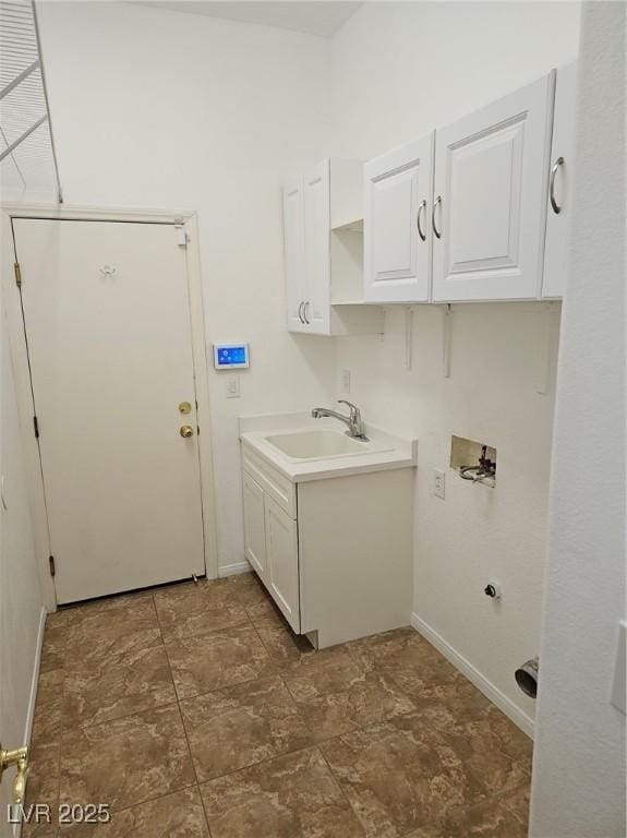 clothes washing area with washer hookup, sink, and cabinets