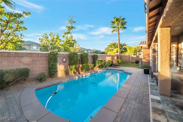 view of swimming pool with a patio area