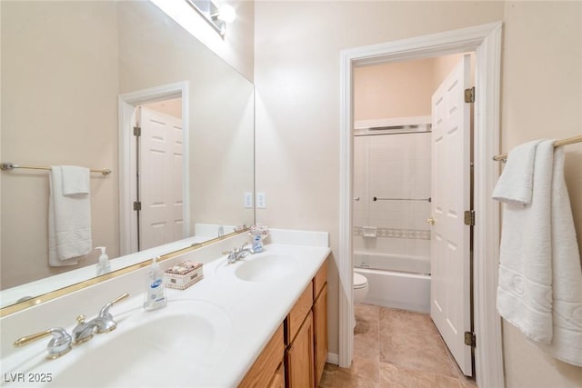 full bathroom with tile patterned flooring, enclosed tub / shower combo, vanity, and toilet