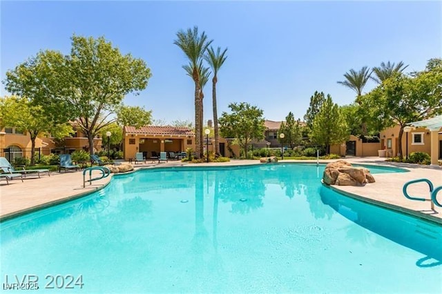 view of pool featuring a patio area