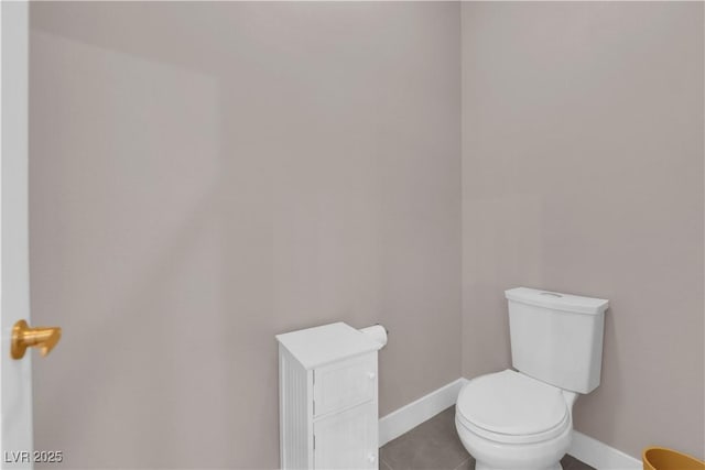 bathroom with tile patterned floors and toilet